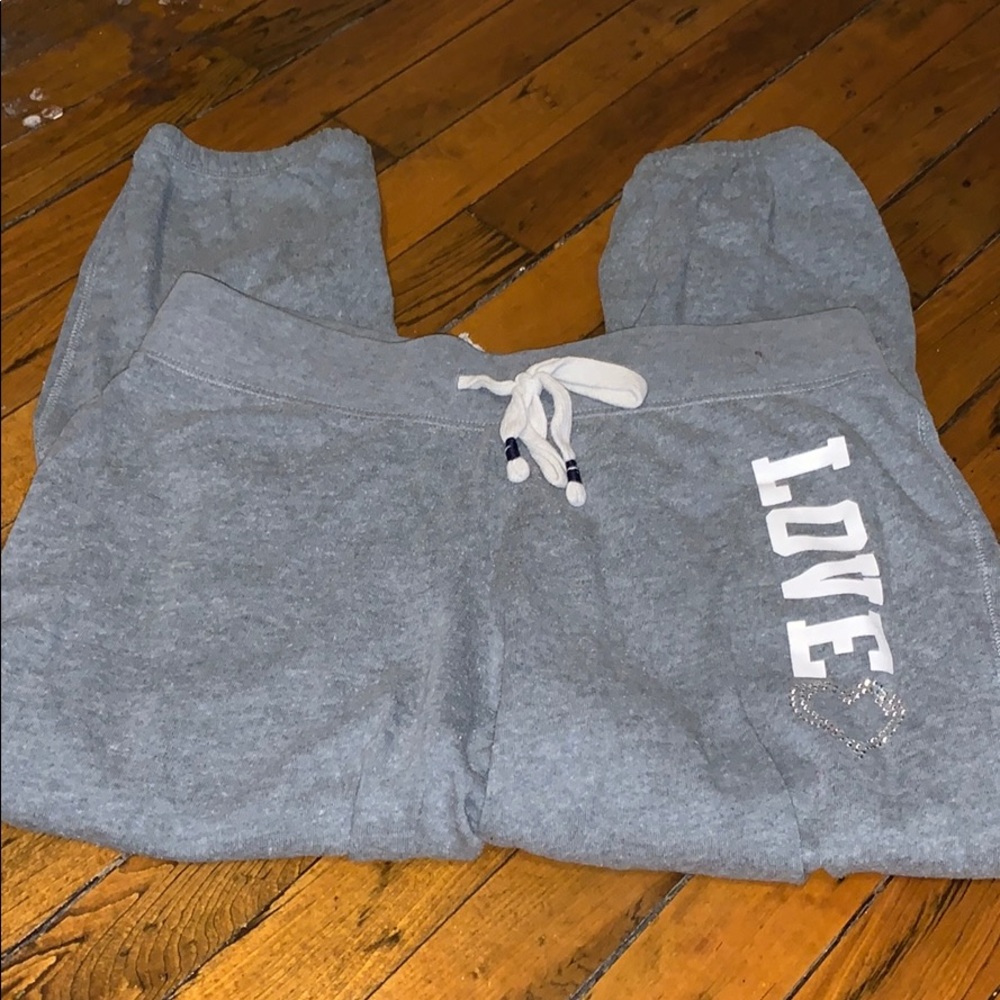 Capri sweatpants that are cinched are the bottom